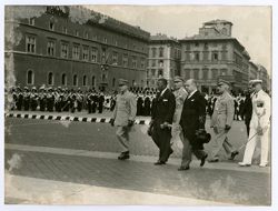 President William V. S. Tubman walks with government and military officials during a parade