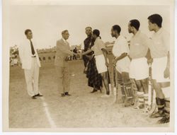 Ambassador C. T. O. King meeting field hockey team