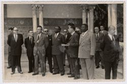 President Tubman and other dignitaries stand on a patio in Seville, Spain