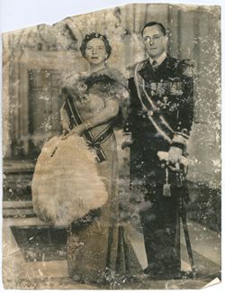 Couple stands in formal attire