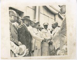 President William V. S. Tubman greets group of military officials outside