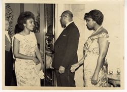 Two women greet each other at party