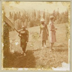 Mrs. Antoinette Tubman and Mrs. Doris Grimes stand outside a cabin before they leave for Lapland-Kiruna