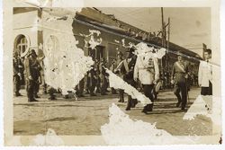 President William V. S. Tubman in formal attire walks with official wearing the Humane Order of African Redemption decoration during a parade