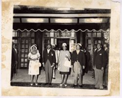 President William V. S. Tubman and others pose for portrait in front of doorway