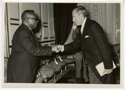 President William V. S. Tubman greets dignitary in formal room