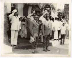 President William V. S. Tubman stands with military officials in front of  building