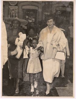 Mrs. Tubman and Carmen Polo walking with Coocoo Tubman