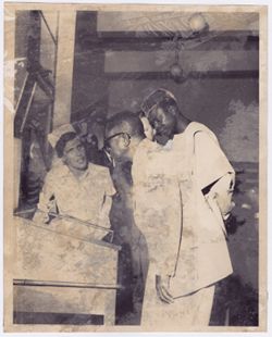 President William V. S. Tubman examines display case