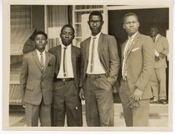 Charles Ebue King and others pose for portrait