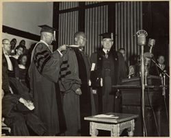 Dr. Mordecai Johnson presides over convocation as President William V. S. Tubman receives Honorary LL. D. degree