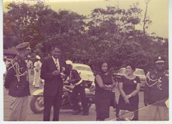 Men in uniform and guests preparing for vehicular procession