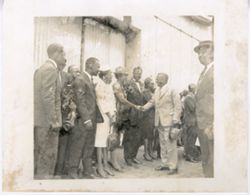 President William V. S. Tubman shakes hands and greets a woman and guests