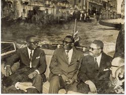 President William V. S. Tubman sits with Cabinet members in back of boat