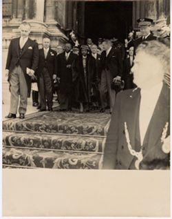 President Tubman and other men in formal attire exiting building