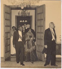 President and Mrs. Tubman at head of guests entering room