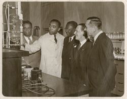 Ambassador Clarence L. Simpson Sr., President William V. S. Tubman, Harvey S. Firestone Jr. and other on tour of Firestone