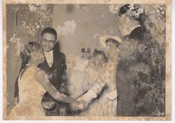 Guests shake hands at a party