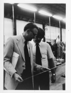 Versailles factory: Hamilton holding measuring rod
