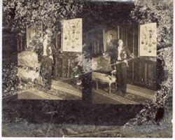 Contact Sheet: Official and President William V. S. Tubman stand in  formal, wood paneled room, next to couch