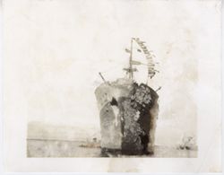 Large ship displaying many flags