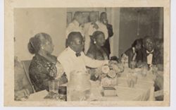 President William V. S. Tubman and Mrs. Tubman seated at dinner party