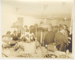Group of guests beside large table
