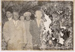 President Tubman standing with men in military and business attire
