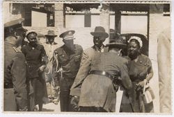Spanish military official shakes hands with Mrs. Tubman in or near Toledo, Spain