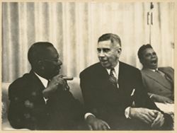 President William V. S. Tubman chats with Mr. White during business lunch, Ambassador Simpson in the backgroun