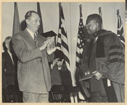 Lee R. Jackson applaudes President William V. S. Tubman after receiving honorary LL.D.