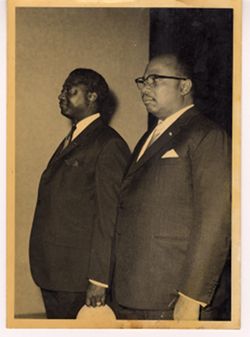 Vice President Tolbert stands with another dignitary