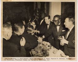 John F. Floberg, J. Ward Keener, Mayor Leo Berg, J. A. Meek, Charles D. Sherman, Raymond C. Firestone, President Tubman and Harvey S. Firestone, Jr.