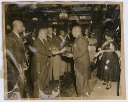 President Tubman hands a document to a dignitary
