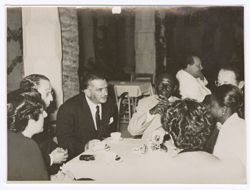 President William V. S. Tubman and other seated at table talking