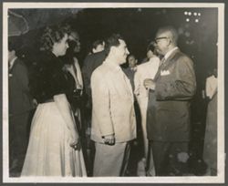 President William V. S. Tubman talks with party goers