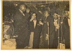 Liberian government officials and guests drink a toast
