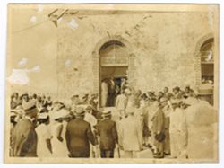 Guests gather outdoors around President William V. S. Tubman and Mrs. Tubman as they arrive