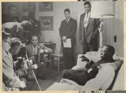 President William V. S. Tubman sits and talks with reporters during a press conference