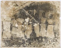 Mrs. Antionette Tubman, Wilhelmina (CooCoo) Tubman, Olunbake King stand with others
