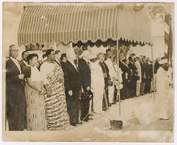 Dignitaries lined up in front of a building
