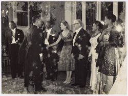Dignitaries shake hands with Carla Gronchi al Quirinale at a reception in Italy