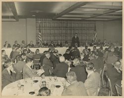 Reception at the District building, President William V. S. Tubman sits at head table next to speaker