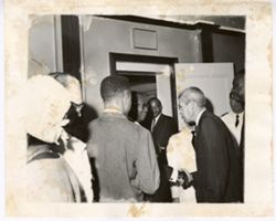 Group stand together in doorway