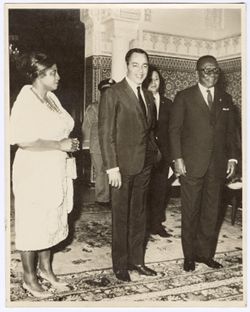 President William V. S. Tubman and Mrs. Tubman  pose with a dignitary