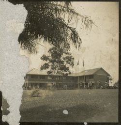 Exterior shot of large building with crowd around