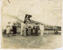 President William V. S. Tubman and officials stand in front of EL-AAB airplane