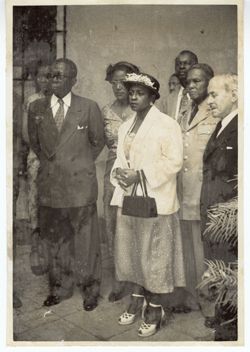 President and Mrs. Tubman stand with dignitaries