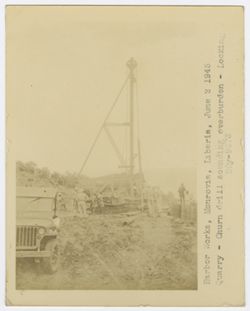 Workers check on a Quarry- Churnt drill because it was sounding overburdened