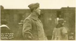 C. P. Robbins at train station while members of Base Hospital 13 leave Limoges
